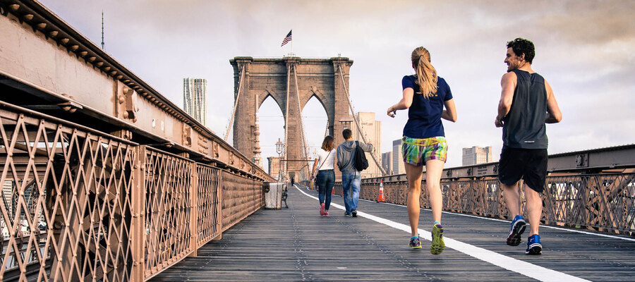 People running over a bridge