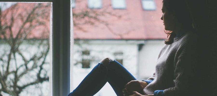 Woman looking out of a window