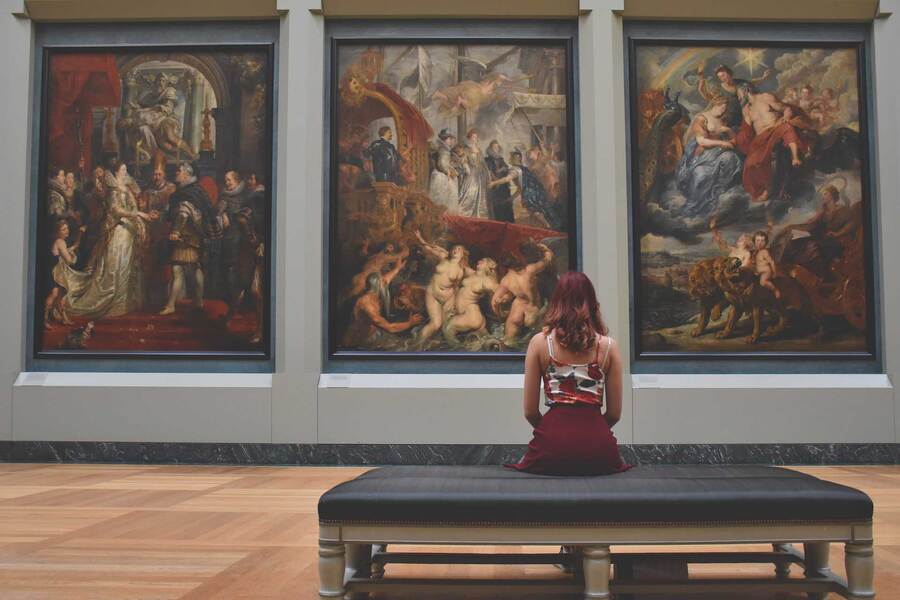 Woman sitting in an art gallery